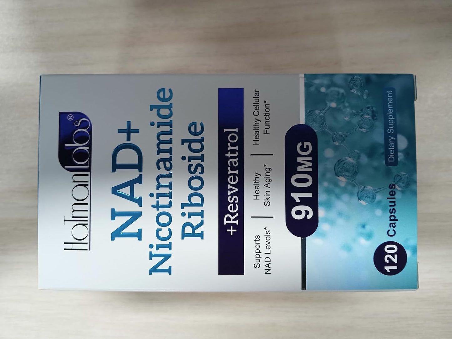 Box of NAD+ Nicotinamide Riboside with Lloydlabs branding on a wooden surface